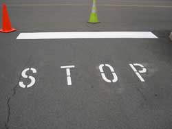 Superior Line Striping STOP signage in parking lot by Superior Line Striping